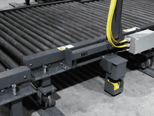 a conveyor belt with a yellow strap